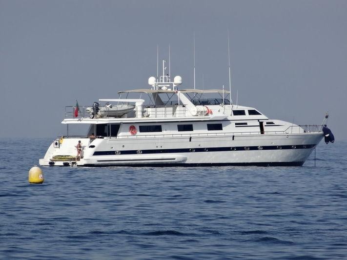 a white boat in the water aboard QUEEN SOUTH Yacht for Charter
