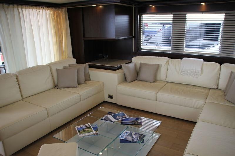 a living room with a couch and a coffee table aboard GATSBY Yacht for Charter