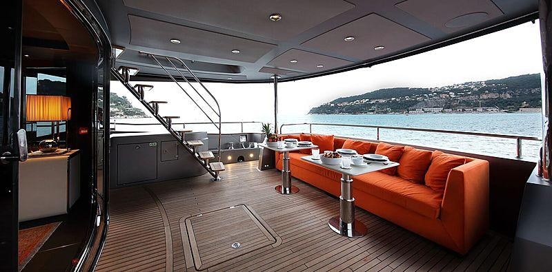 a room with a table and a couch aboard MIRKA Yacht for Charter