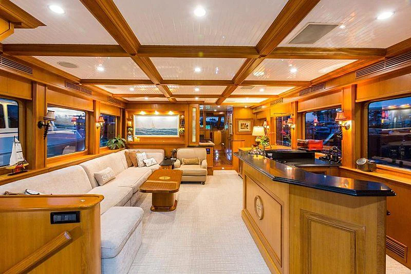 a large living room with a kitchen and a bar aboard ENDLESS SUMMER Yacht for Charter