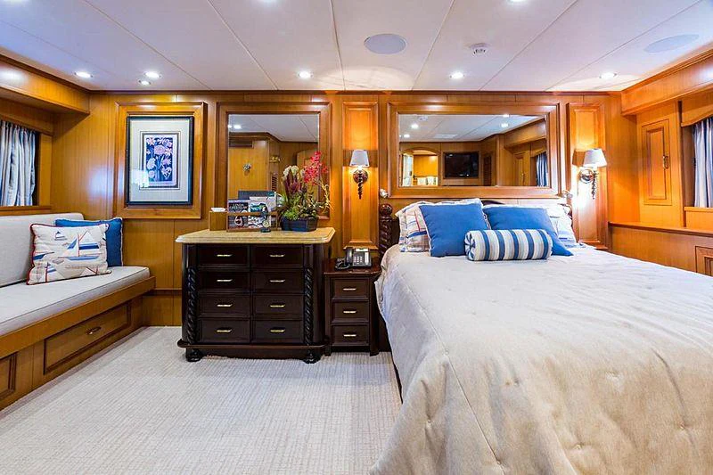 a bedroom with a bed and a desk aboard ENDLESS SUMMER Yacht for Charter