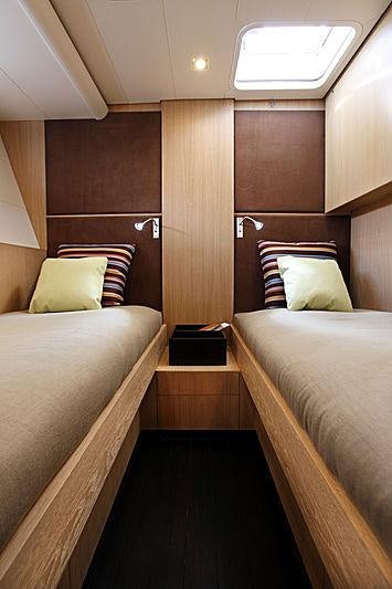 a room with two beds aboard YCH2 Yacht for Charter