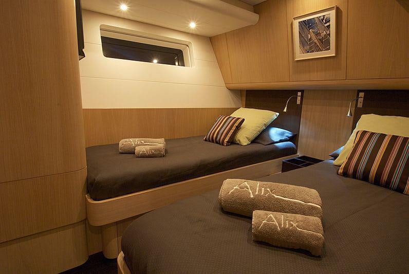 a room with a couch and a bed aboard YCH2 Yacht for Charter
