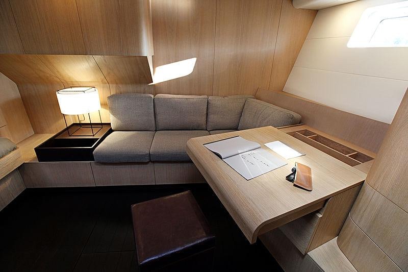 a couch and a coffee table in a room aboard YCH2 Yacht for Charter