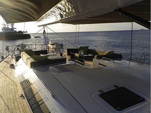 a deck with a view of the ocean and a deck aboard YCH2 Yacht for Charter