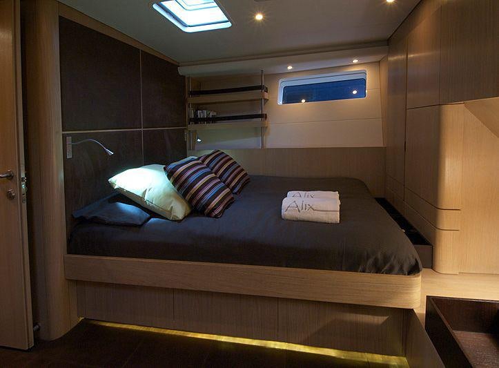 a bed in a room aboard YCH2 Yacht for Charter