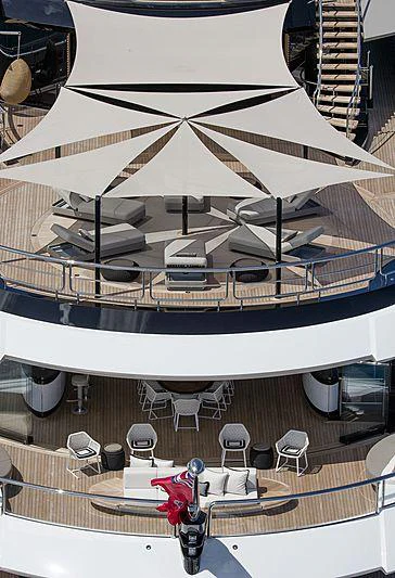 a large white boat with chairs and tables on it aboard WHISPER Yacht for Charter