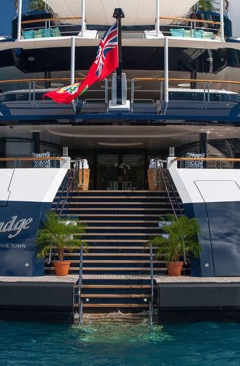 a boat with a flag on the front aboard SOLANDGE Yacht for Charter