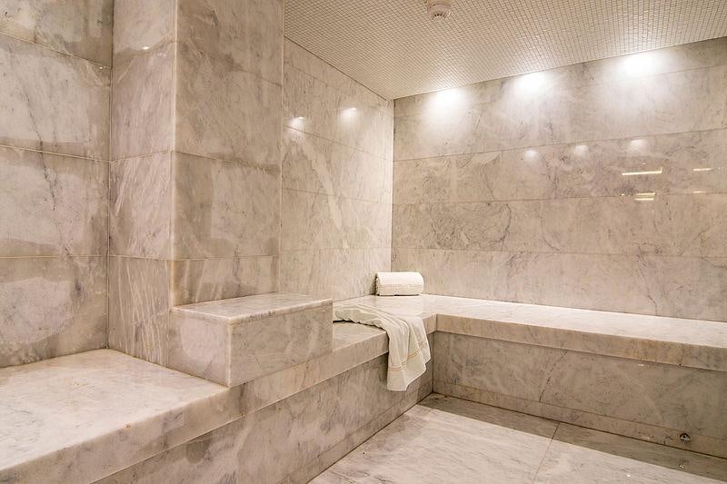 a bathroom with a bathtub and a sink aboard O'PTASIA Yacht for Charter