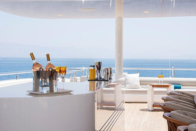 a room with a table and chairs aboard O'PTASIA Yacht for Charter