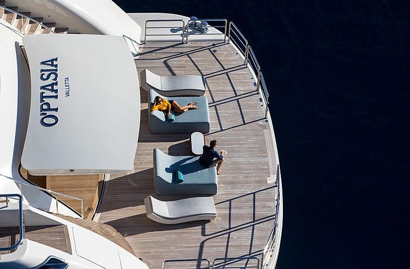 a couple of people on a boat aboard O'PTASIA Yacht for Charter