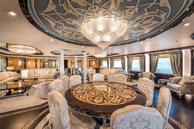 a large room with a large chandelier aboard ELEMENTS Yacht for Charter