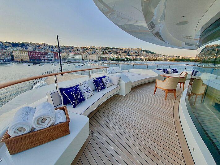 a balcony with a view of a city aboard MIMTEE Yacht for Charter