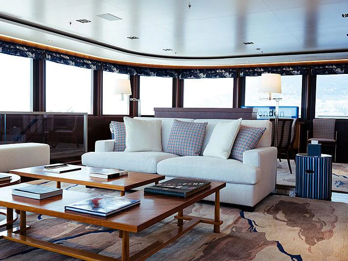 a living room with a couch and a coffee table aboard PLANET NINE Yacht for Charter