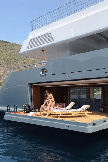 a person sitting on a boat aboard PLANET NINE Yacht for Charter