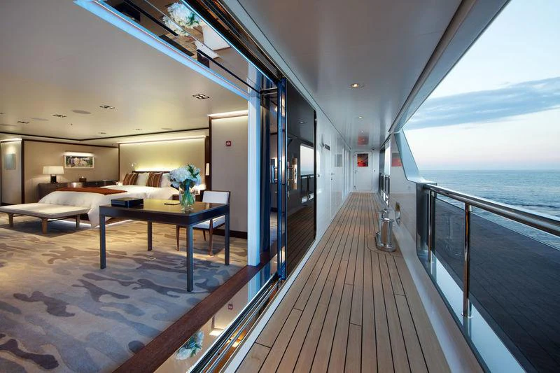 a room with a table and couches aboard PLANET NINE Yacht for Charter