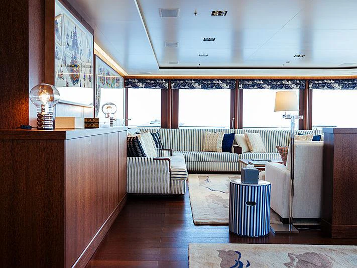 a room with a couch and a table aboard PLANET NINE Yacht for Charter