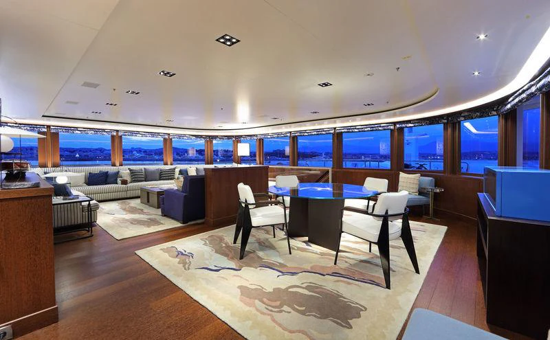 a room with a table and chairs aboard PLANET NINE Yacht for Charter