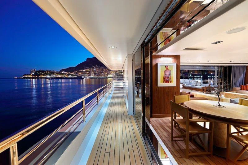 a deck with a view of the water and a city aboard PLANET NINE Yacht for Charter