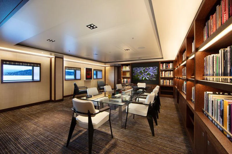 a room with a table and chairs aboard PLANET NINE Yacht for Charter