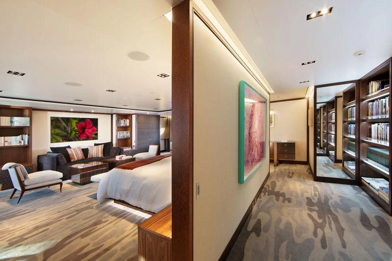 a living room with a large mirror aboard PLANET NINE Yacht for Charter