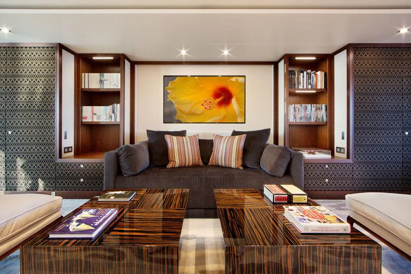 a living room with a couch and a table aboard PLANET NINE Yacht for Charter