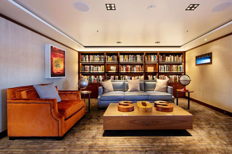 a living room with a couch and a coffee table aboard PLANET NINE Yacht for Charter