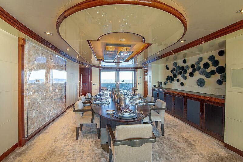 a large room with a table and chairs aboard ARBEMA Yacht for Charter