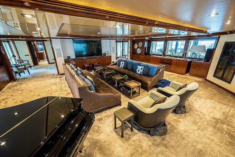 a large living room with a large window aboard ARBEMA Yacht for Charter