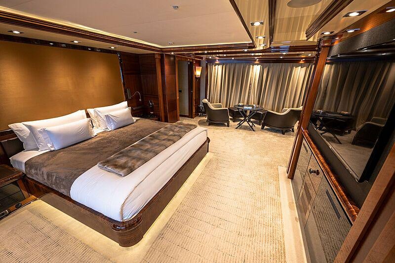 a large bedroom with a bed aboard ARBEMA Yacht for Charter