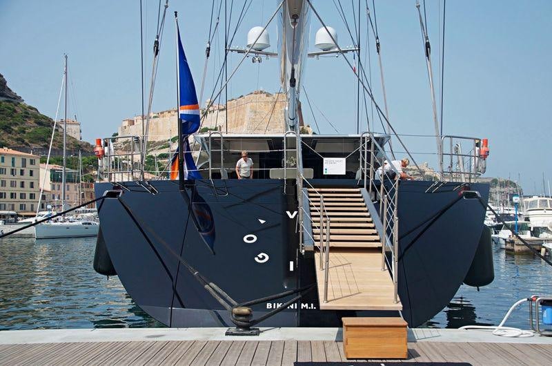 a large boat on a dock aboard VERTIGO Yacht for Charter
