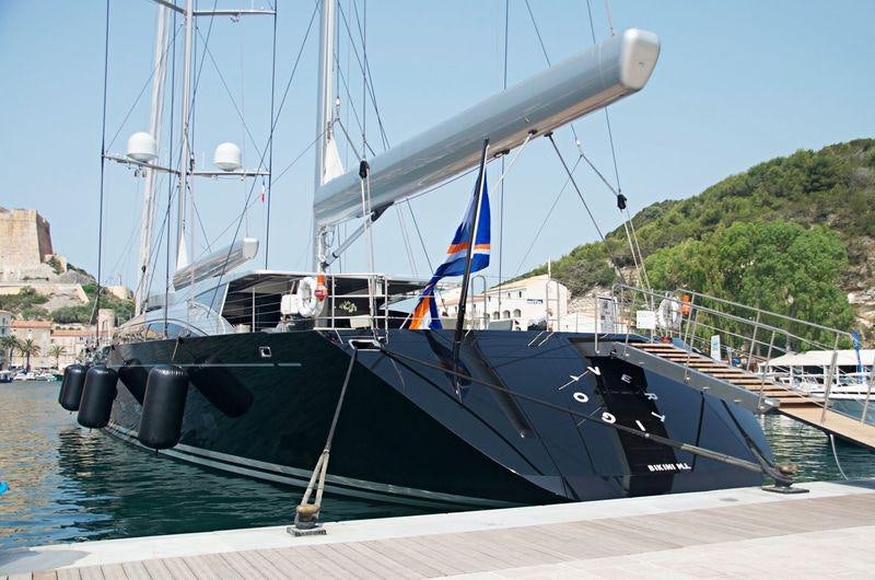 a boat docked at a pier aboard VERTIGO Yacht for Charter