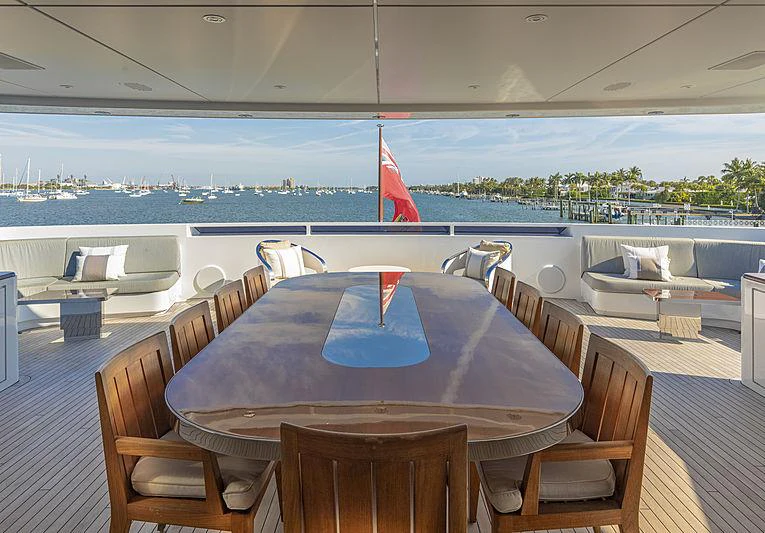 a table with chairs on it aboard ILLUSION Yacht for Charter