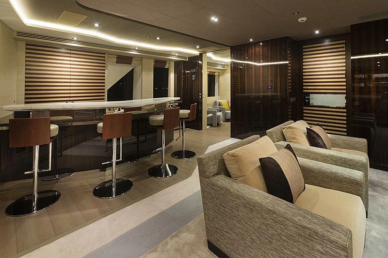 a room with a couch and a piano aboard ILLUSION Yacht for Charter
