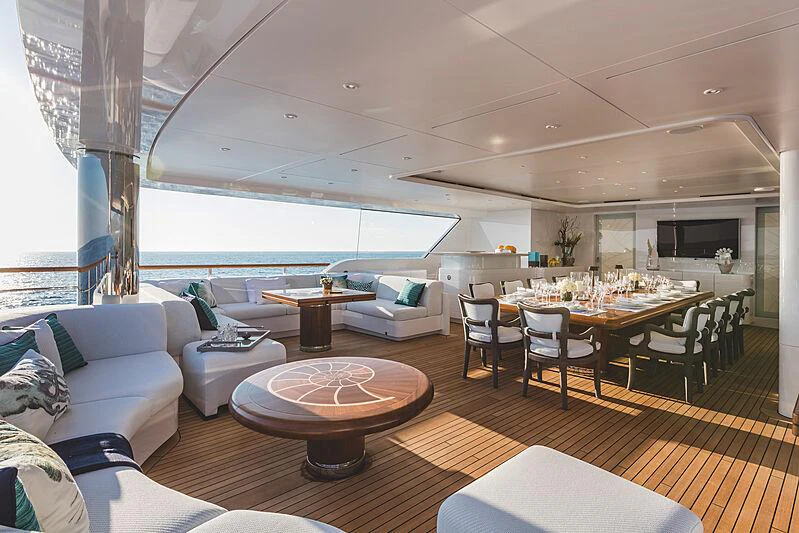 a living room with a large patio aboard MOCA Yacht for Charter