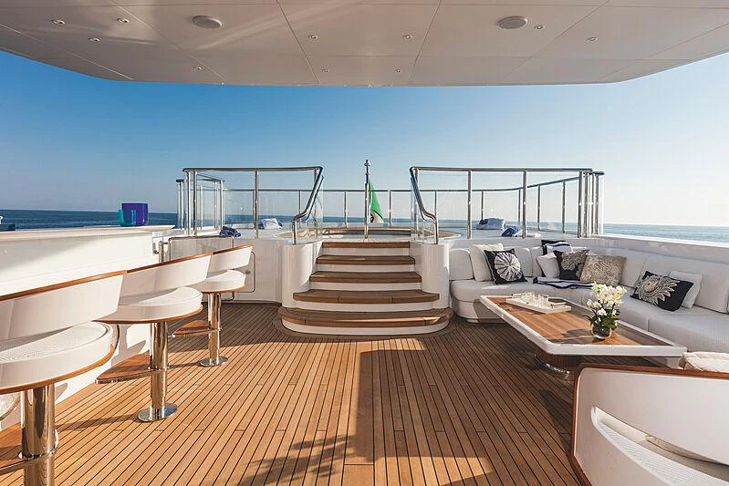 a living room with a balcony aboard MOCA Yacht for Charter