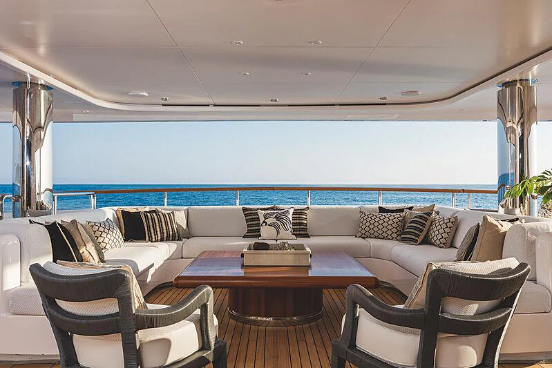 a living room with a table and chairs aboard MOCA Yacht for Charter