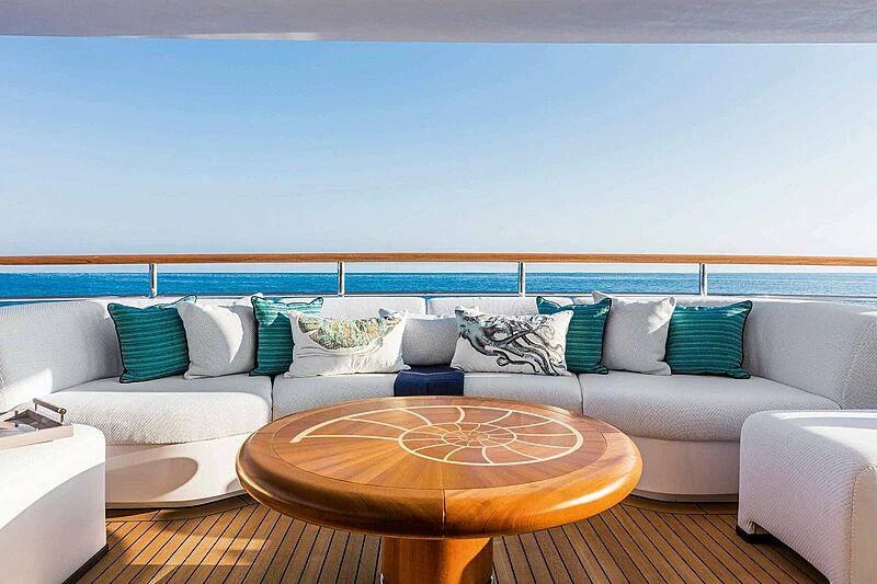 a living room with a couch and a table aboard MOCA Yacht for Charter
