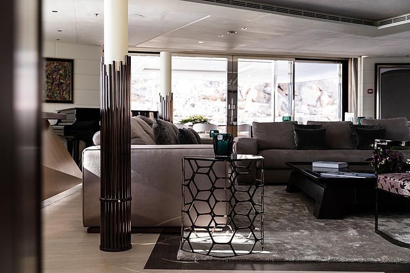 a living room with a couch and a table aboard ARTISAN Yacht for Charter