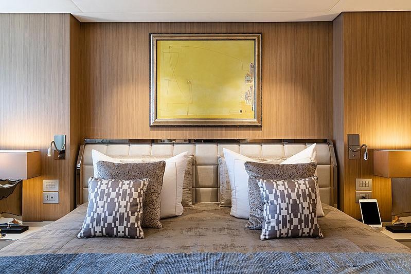 a bed with pillows aboard ARTISAN Yacht for Charter