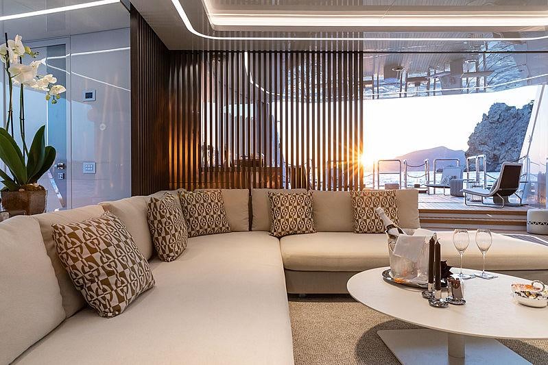 a living room with a large window aboard ARTISAN Yacht for Charter