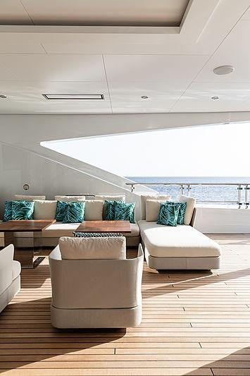 a room with a couch and a table aboard ARTISAN Yacht for Charter