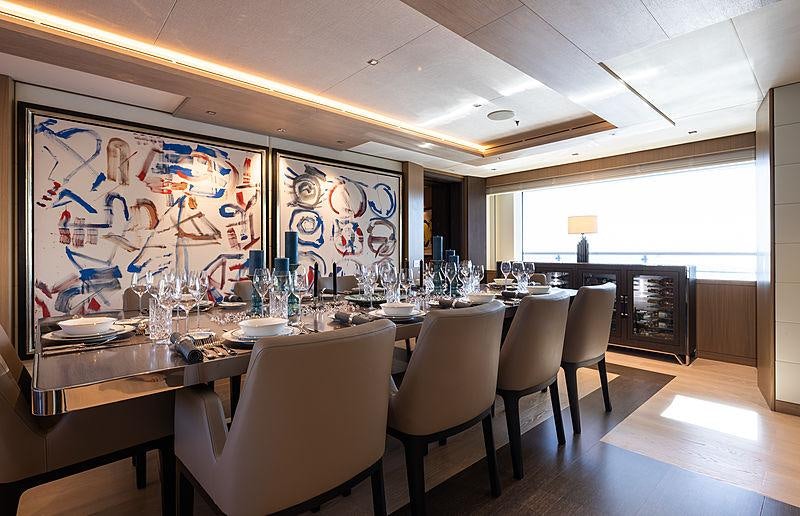 a large room with a table and chairs aboard ARTISAN Yacht for Charter