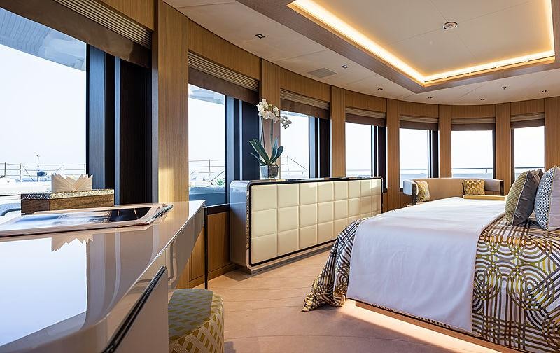 a room with a bed and a window aboard ARTISAN Yacht for Charter