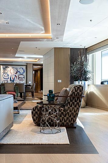 a living room with a couch and a table aboard ARTISAN Yacht for Charter