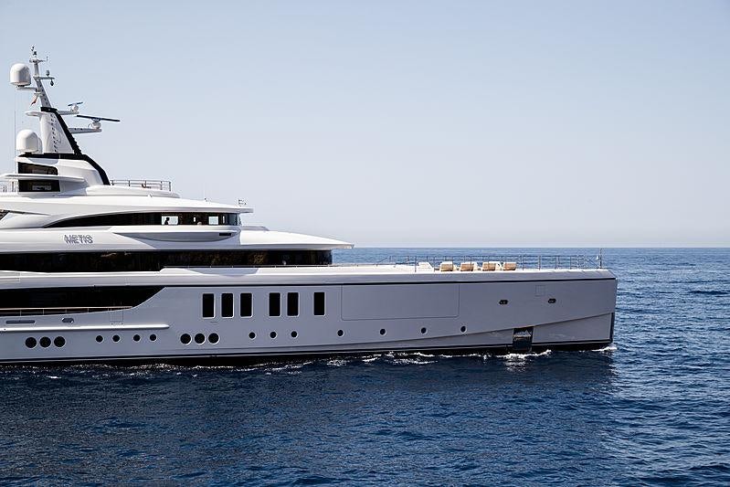 a couple of large white yachts in the water aboard ARTISAN Yacht for Charter