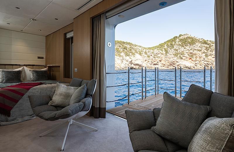 a living room with a large window aboard ARTISAN Yacht for Charter