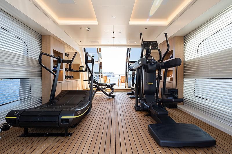 gym with exercise equipment aboard ARTISAN Yacht for Charter