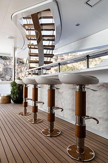 a white table with a lamp on it aboard ARTISAN Yacht for Charter