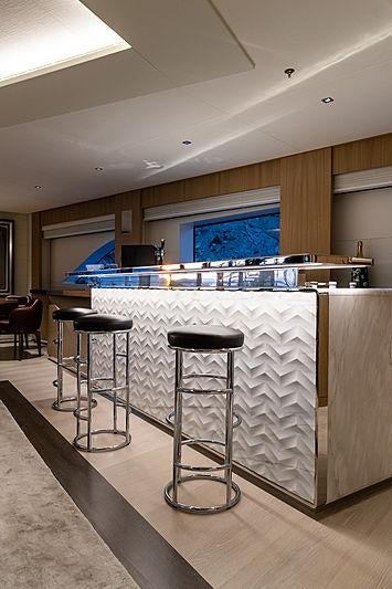 a kitchen with stools and stools aboard ARTISAN Yacht for Charter